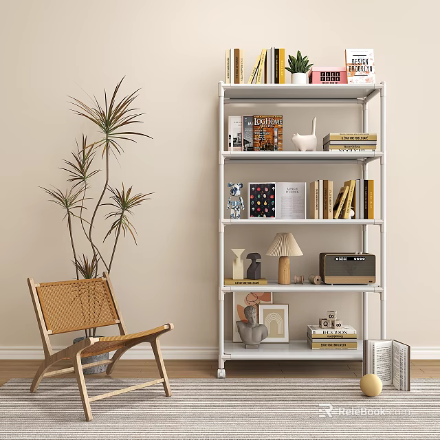 White Multi Tiered Bookshelf With Books Decorations Lamp Photo Frame Near Wicker Chair And Plant 3d model 