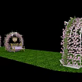Decorative Event Archway Adorned With Pink Flowers Green Grass And Small Table