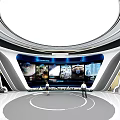 Modern Hi tech Exhibition Hall with Circular Design and Large Screens Featuring Two People