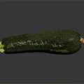 Fresh Ripe Green Zucchini Vegetable With Smooth Skin On Dark Background