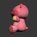 Pink Cartoon Teddy Bear Toy With Yellow Heart Belly And Paws On Black Background