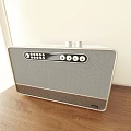 Modern Sound Speaker With Sleek Design Knobs Buttons And Display Screen On Wooden Table 3d model