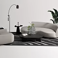 Modern Gray Sofa And Black Coffee Table With Striped Rug Floor Lamp And Potted Plant