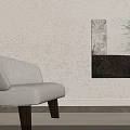 Beige Accent Chair With Wooden Legs By Abstract Painting On Textured Wall And Wooden Floor