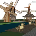 Traditional Wooden Windmills Water Wheel And Pavilion In Scenic Outdoor Setting With Deck