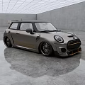 Silver Gray MINI Cooper With Black Roof Orange Stripes In Modern Indoor Space