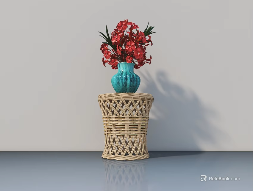 Blue Vase with Vibrant Red Flowers on Wicker Table Against Light Wall and Gray Floor 3d model 
