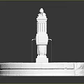 White Stone Fountain Structure With Circular Base Central Column And Sand Area