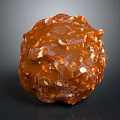 Caramel Colored Nutty Candy Ball with Glossy Texture and Crunchy Nut Pieces