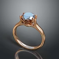 Rose Gold Ring Featuring Blue Gemstone With Elegant Design And Reflection 3d model