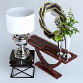 Elegant Wooden Dressing Table with Silver Lamp Gold Frame Mirror Green Plant and Tall Vase