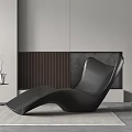 Modern Black Curved Lounge Chair In Minimalist Interior With Side Table And Floor Lamp