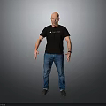 Bald Man In Black T-shirt And Blue Jeans Standing Against Gray Background