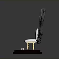 White Chair Shaped Sculpture With Feather Backrest Dark Base And Golden Legs