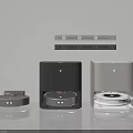Robot Vacuum Cleaners With Charging Docks In Gray Black Silver On White Wall Gray Countertop