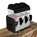 Black Beverage Dispenser With Red Green Orange Drinks On Wooden Countertop