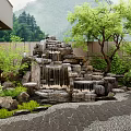 Courtyard Garden With Rock Waterfall Trees Green Plants And Pebble Path