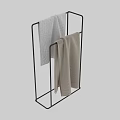 Soft Beige Cotton Bath Towels Hanging On Metal Rack For Bathroom Use