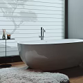 White Freestanding Bathtub Beside Window With Plantation Shutters Small Side Table And Soft Rug