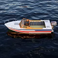 Small Stylish Yacht With White Red Blue Stripes On Calm Water
