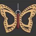 Golden Butterfly Shaped Commercial Equipment With Circular Dots Red Center And Hanging Hook