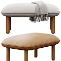 Light Gray Padded Sofa Stools With Wooden Legs And Checkered Fringe Blanket