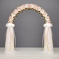 Elegant Flower Arch Featuring Pink White Flowers White Drapes And Ribbons