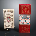 Red And Beige Decorative Books With Floral And Ornamental Patterns