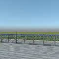Outdoor Stainless Steel Fence On Wooden Platform With Green Grass And Blue Sky