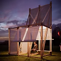 Modern Wooden Pergola With Mesh Panels On Grass At Sunset With People And Red Balloon