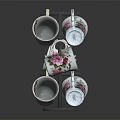 Decorative White Ceramic Mugs With Floral Patterns On Multi Tiered Metal Display Rack