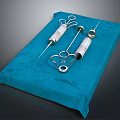 High Quality Medical Instruments Including Syringes And Metal Components On Blue Pad