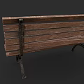 Worn Outdoor Bench With Damaged Wooden Planks Metal Legs And Green Graffiti