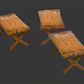 Three Wooden Folding Stools With Cross Legs And Natural Wood Grain
