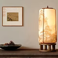 Traditional Chinese Table Lamp With Wooden Base Landscape Shade And Framed Artwork On Cabinet
