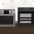 Two Black Kitchen Ovens Against Light Brick Wall And Wooden Floor