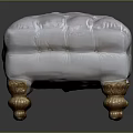 Elegant White Upholstered Ottoman With Gold Carved Legs And Tufted Top