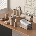 Folded Towels In Neutral Tones With Wooden Bathroom Accessories On Minimalist Bathroom Vanity Table