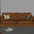 Brown Leather Two Seater Sofa With Neutral Throw Pillows In Cozy Living Room