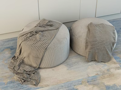 Round Gray Ottoman Poufs with Brown Blanket on Beige Blue Patterned Carpet and White Cabinet 3d model