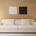 Beige Two Seater Sofa With White And Black Paintings On Wooden Wall And Floor Lamp