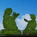 Human Shaped Topiary Shrub Sculptures on Grassland with Blue Sky White Clouds and Red Flowers