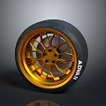 Car Wheel Featuring Golden Rim Black Tire And ADVAN Brand Stylish Design