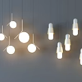 Modern Pendant Lights With Various Designs Hanging And Illuminated On Grey Background