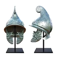 Decorative Ornament Set Showcasing Bronze Helmets On Black Display Bases For Home Decor