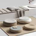 Soft Gray Pillow on White Bench with Gray Blanket and Woven Floor Cushions