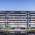 Modern Multi Storey Apartment Building With Balconies And Waterfront Landscaping