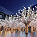 Stunning Plaza Landscape With Illuminated Tree Shaped Structures And White Spherical Lights