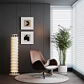 Brown Leather Accent Chair With Wall Art Floor Lamp And Bamboo Plant Near Window