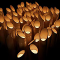 Lit Cylindrical Candles Arrangement Glowing Brightly In Dark Background